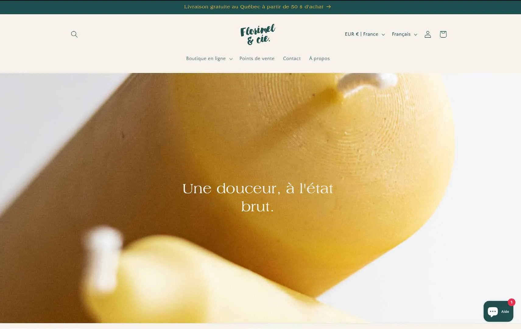 Page d’accueil du site de Florimel & Cie, avec une bougie de cire d’abeille en arrière-plan.